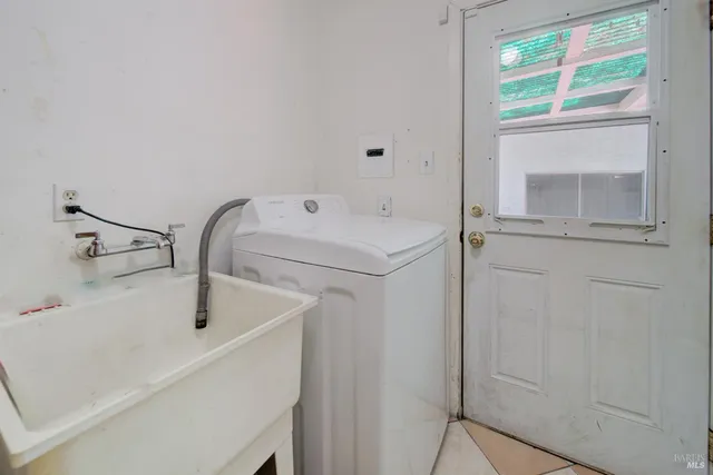 a bathroom with a sink a mirror and a toilet