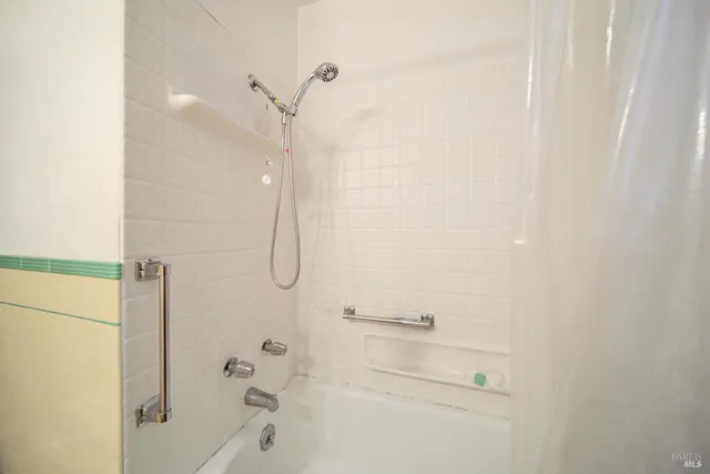 a bedroom with a bed and a table in it