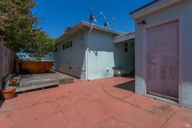 a backyard of a house with seating space