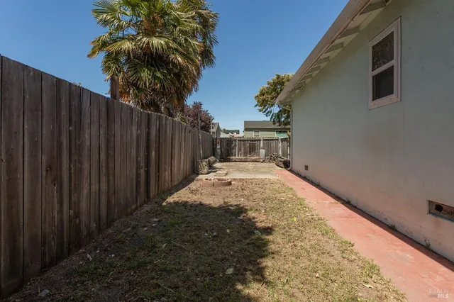 a house with palm tree in front of it