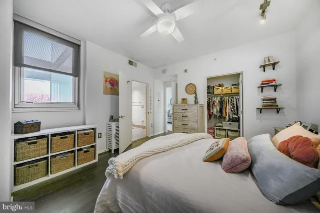 a bedroom with a bed and a cabinets