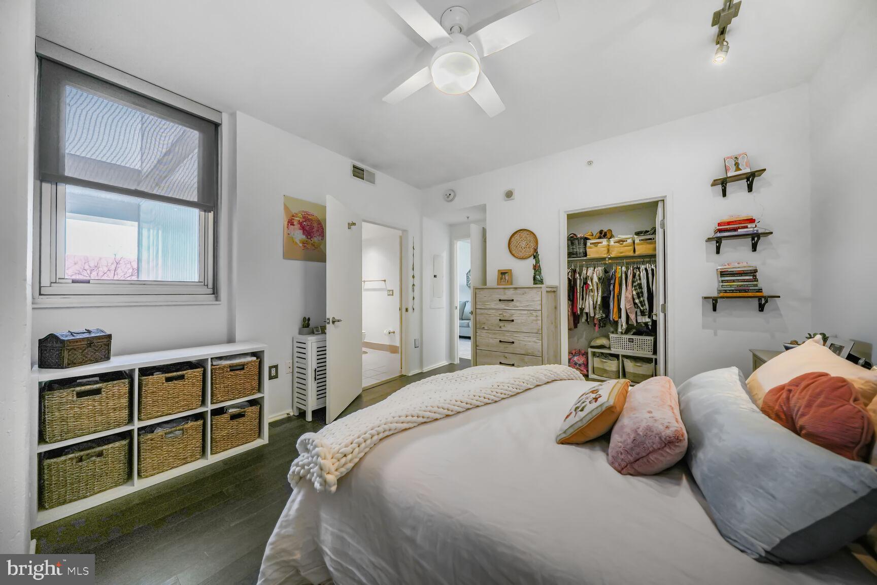3409 Wilson Boulevard, Unit 211 Arlington, VA 22201 - Photo 15 of 30 a bedroom with a bed and a cabinets