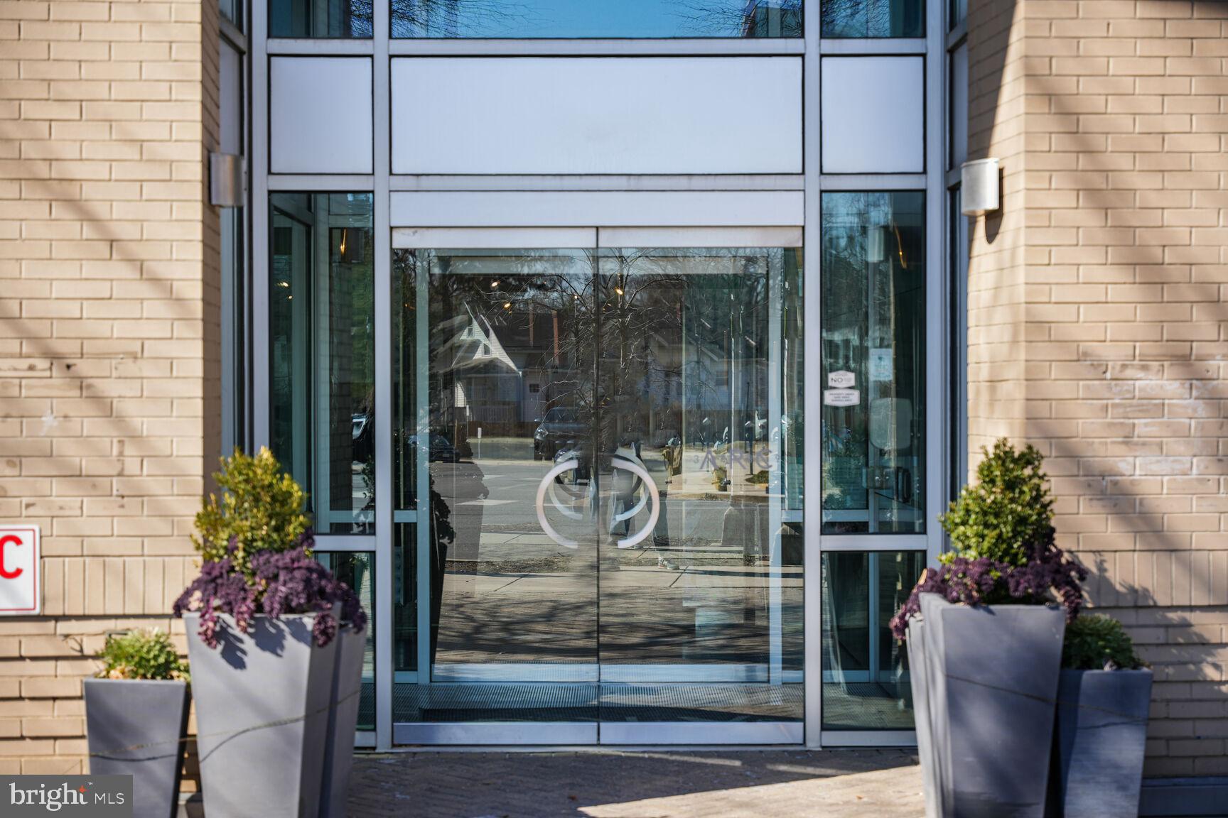 3409 Wilson Boulevard, Unit 211 Arlington, VA 22201 - Photo 19 of 30 a view of a entryway door of the house with potted plants