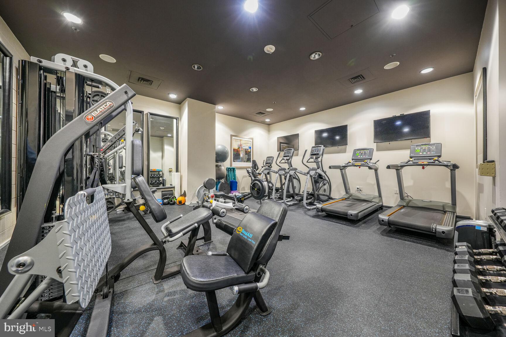 3409 Wilson Boulevard, Unit 211 Arlington, VA 22201 - Photo 22 of 30 a view of a room with gym equipment