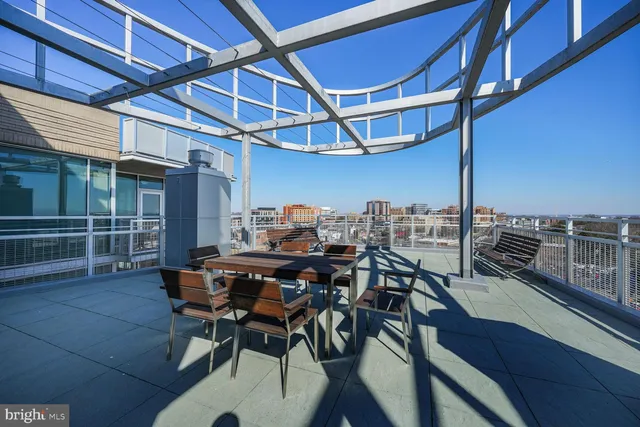 a view of a chairs and table in the balcony