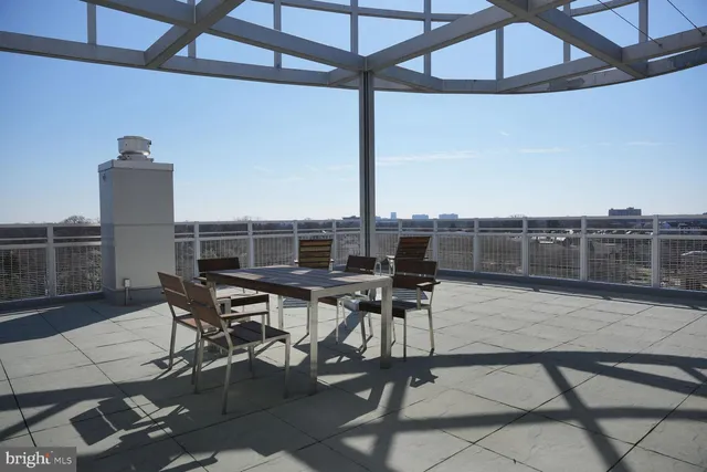 a view of a dinning table and chairs in the terrace