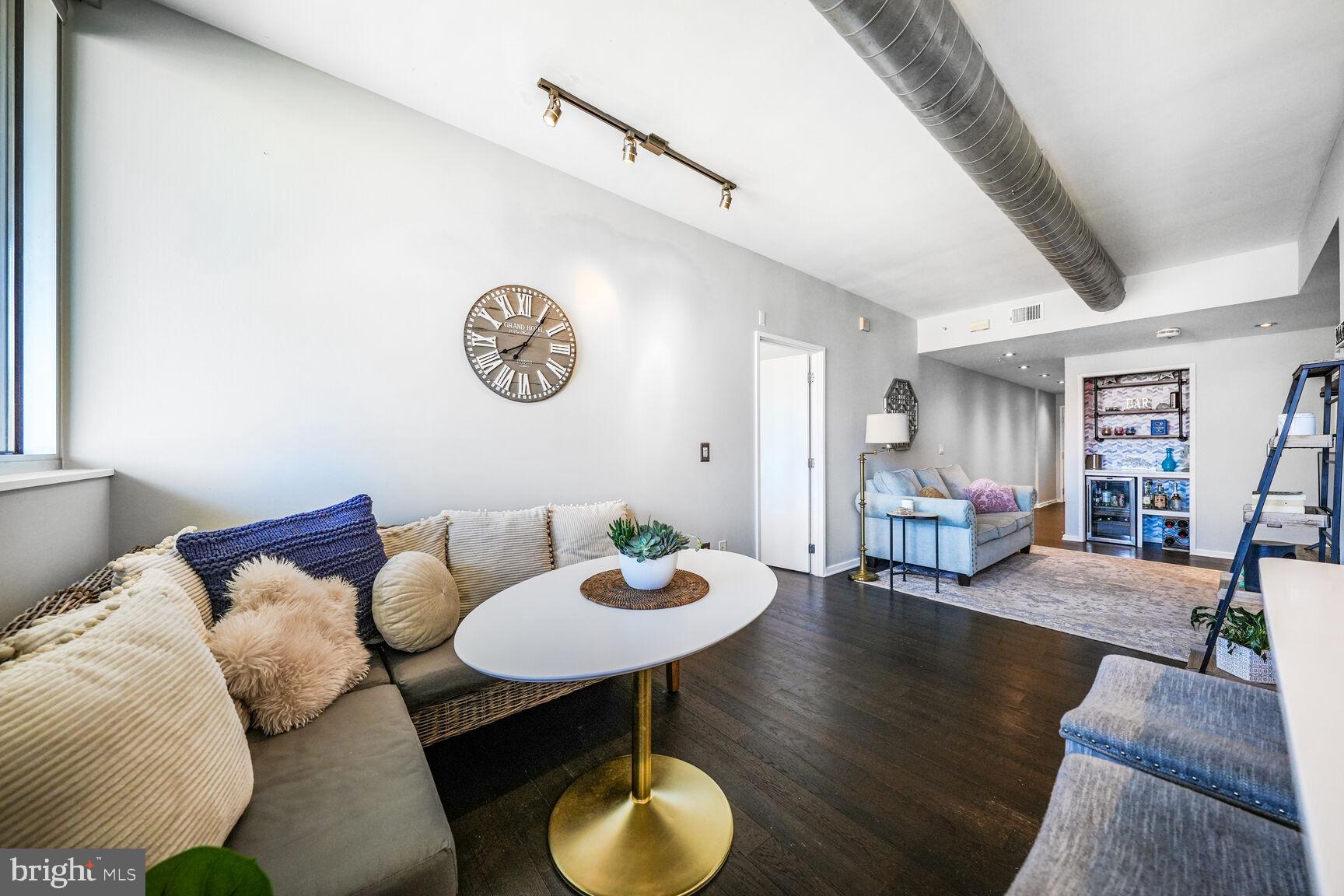 3409 Wilson Boulevard, Unit 211 Arlington, VA 22201 - Photo 6 of 30 a view of a livingroom with furniture and a table