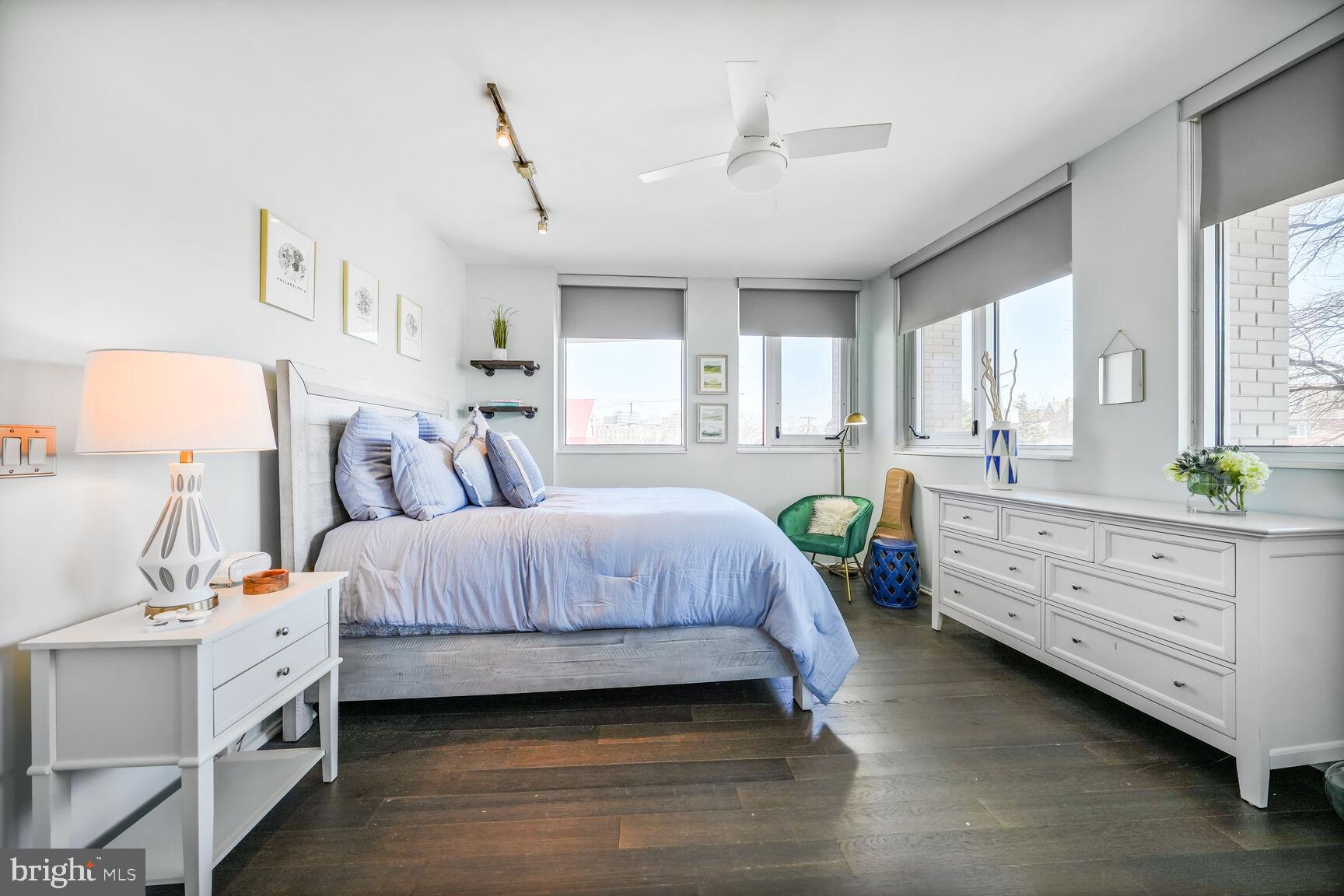 3409 Wilson Boulevard, Unit 211 Arlington, VA 22201 - Photo 9 of 30 a bedroom with a bed and windows