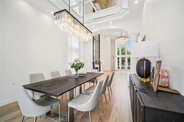 a kitchen with stainless steel appliances granite countertop a sink and dishwasher a refrigerator with wooden cabinets