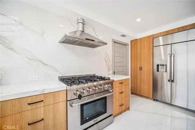 a view of hallway with a window and wooden floor