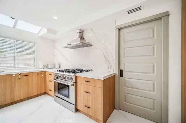 a bedroom with furniture and a white wooden floor