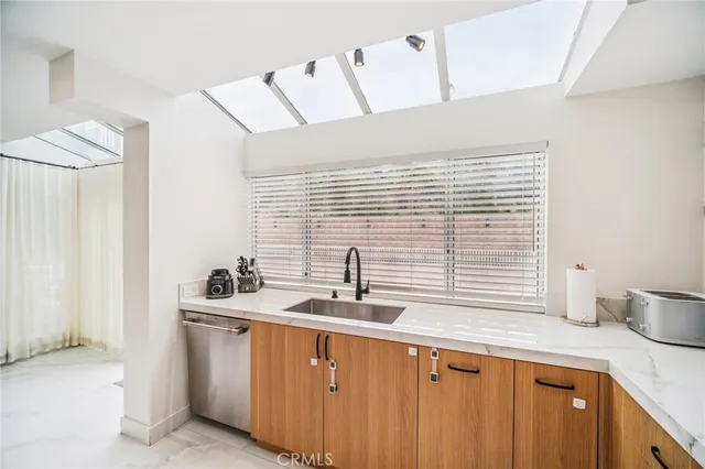 a bathroom with a sink a toilet and bathtub