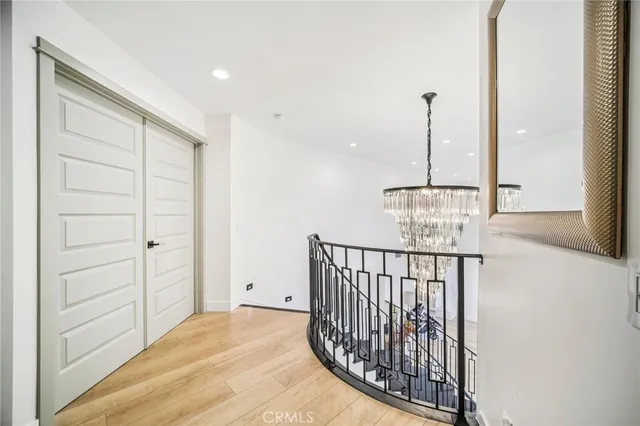 a spacious bathroom with double vanity and a mirror