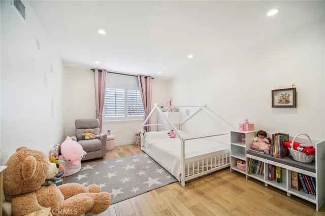a bathroom with a double vanity sink toilet and shower