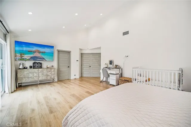 an aerial view of a house with a yard and a lot of flower plants