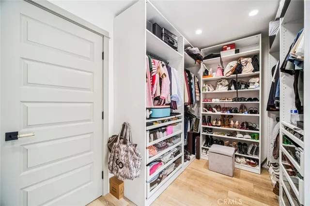 an aerial view of a house with a garden and a large tree