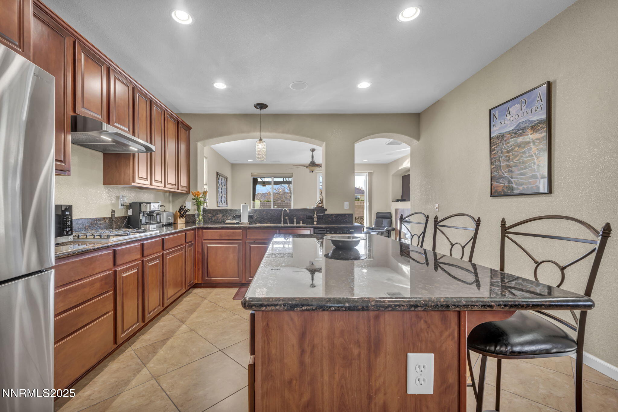11375 Messina Court Reno, NV 89521 - Photo 13 of 52 a kitchen with stainless steel appliances granite countertop a sink and cabinets