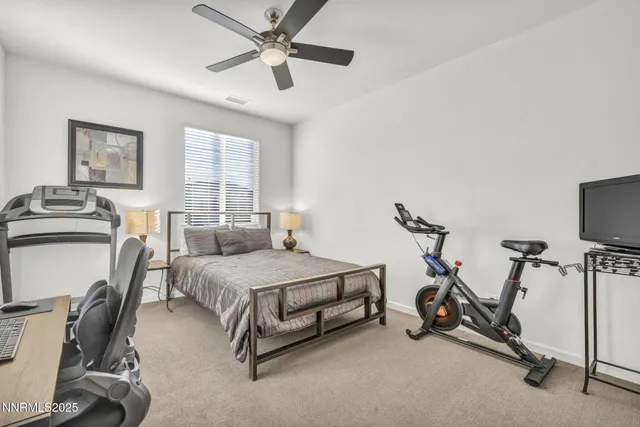 a bedroom with bed and a window