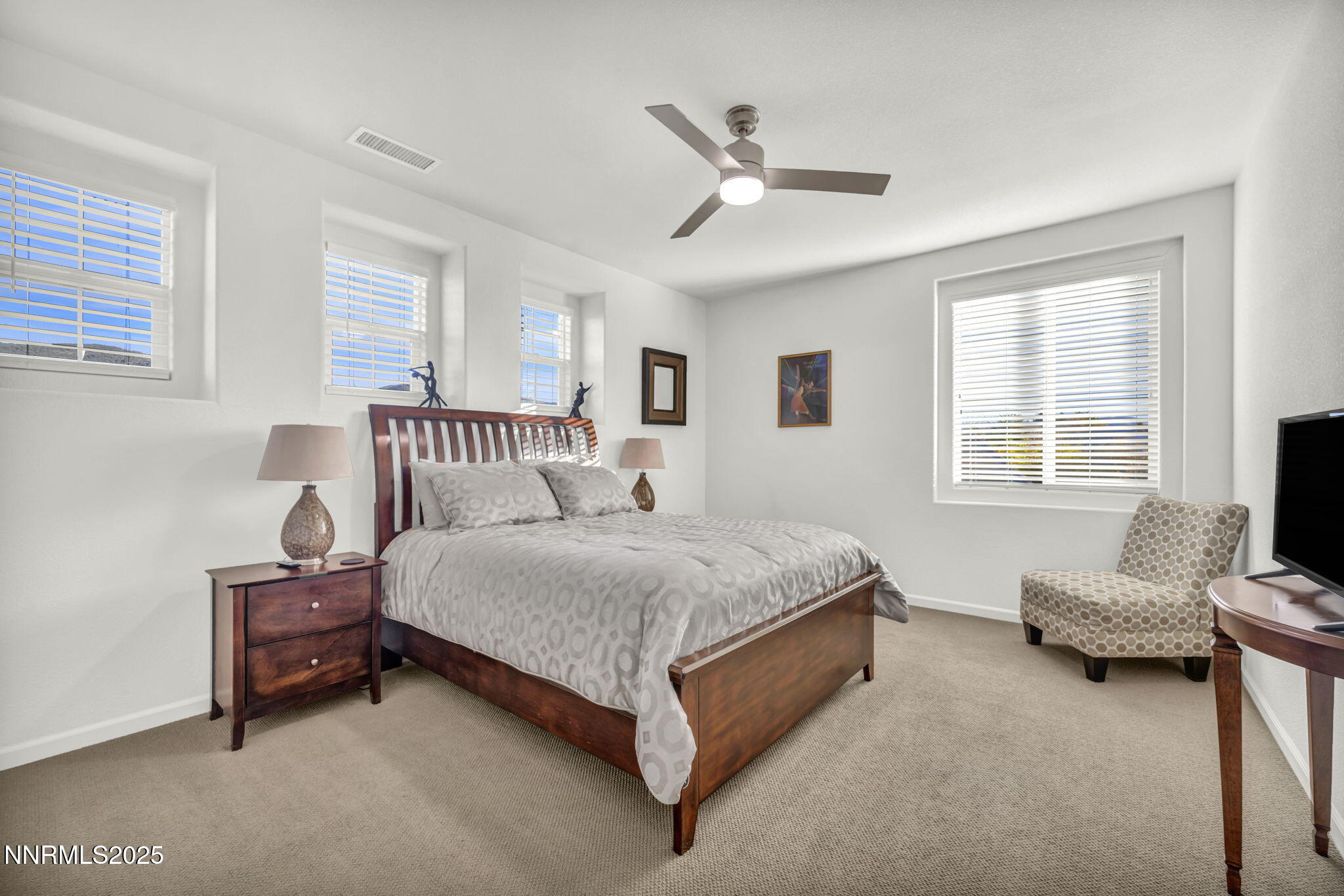 11375 Messina Court Reno, NV 89521 - Photo 28 of 52 a spacious bedroom with a bed and a window