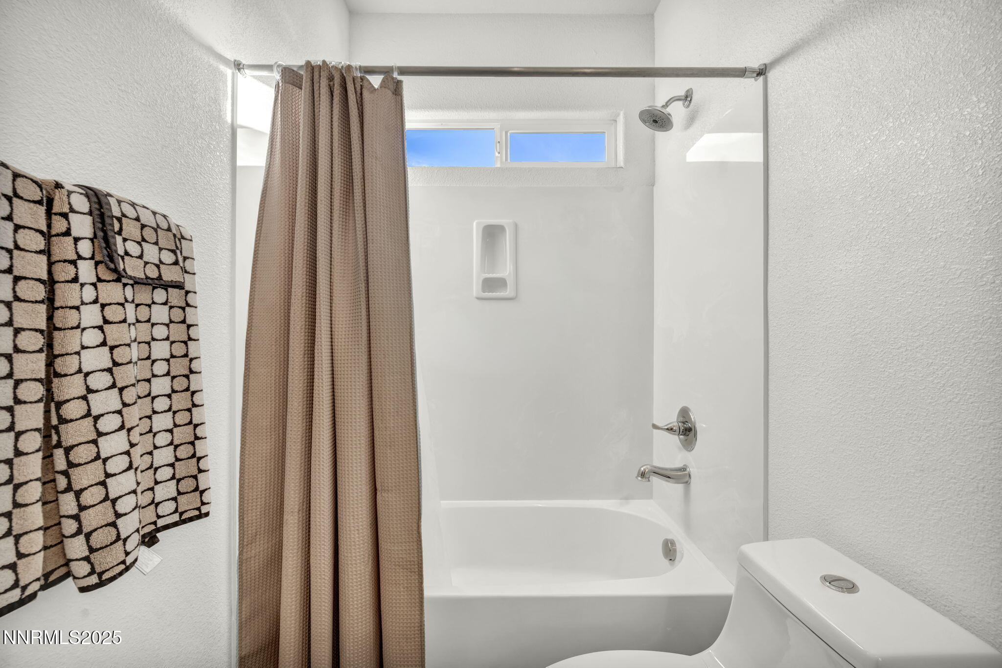 11375 Messina Court Reno, NV 89521 - Photo 32 of 52 a bathroom with a bathtub and a shower