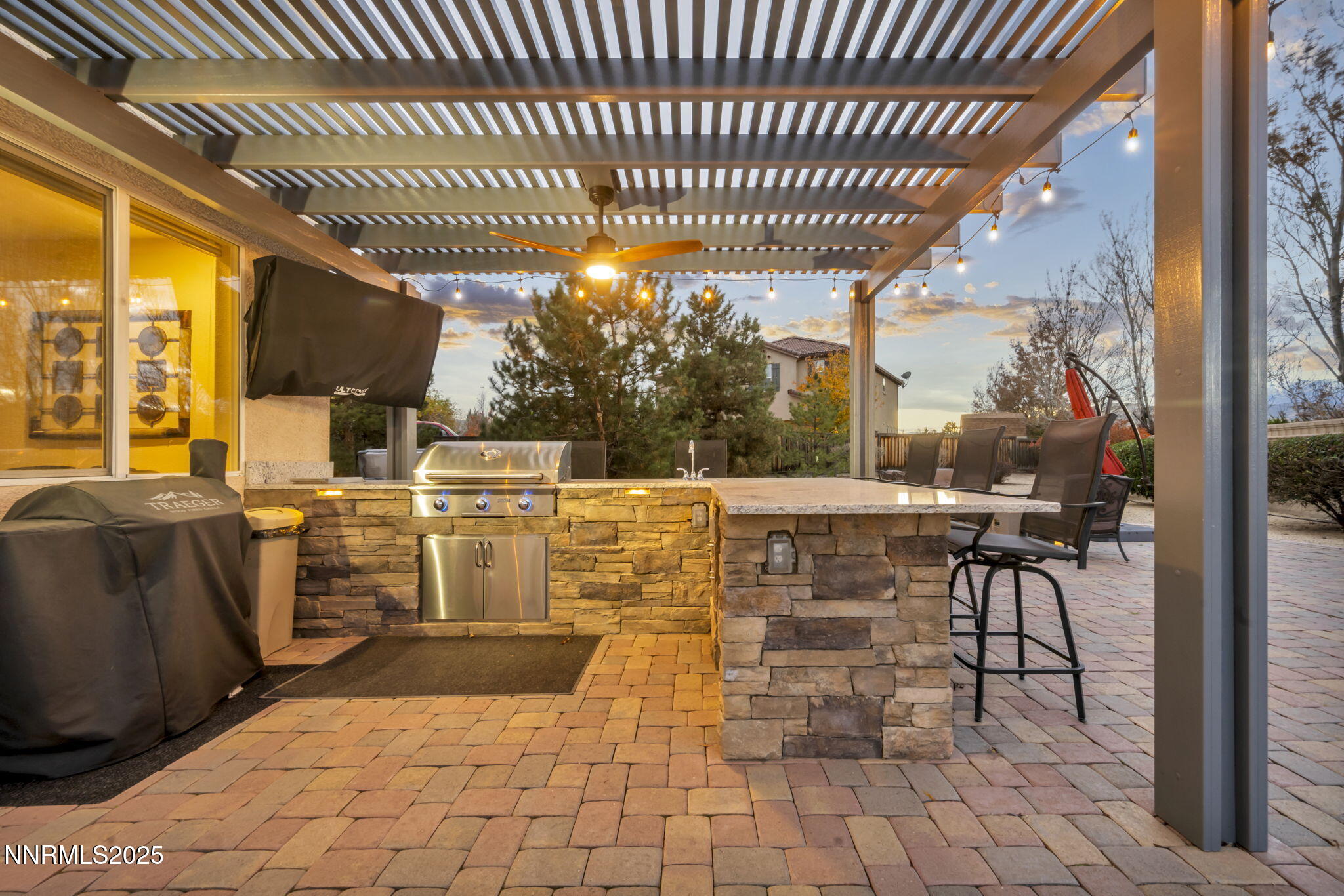 11375 Messina Court Reno, NV 89521 - Photo 37 of 52 a view of a patio with table and chairs with wooden floor and fence