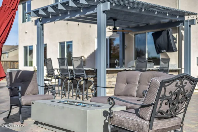 a view of a patio with table and chairs