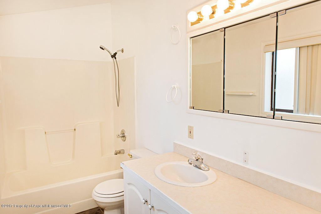 554 Jarrad Avenue Rifle, CO 81650 - Photo 11 of 21 a bathroom with a sink a toilet and shower