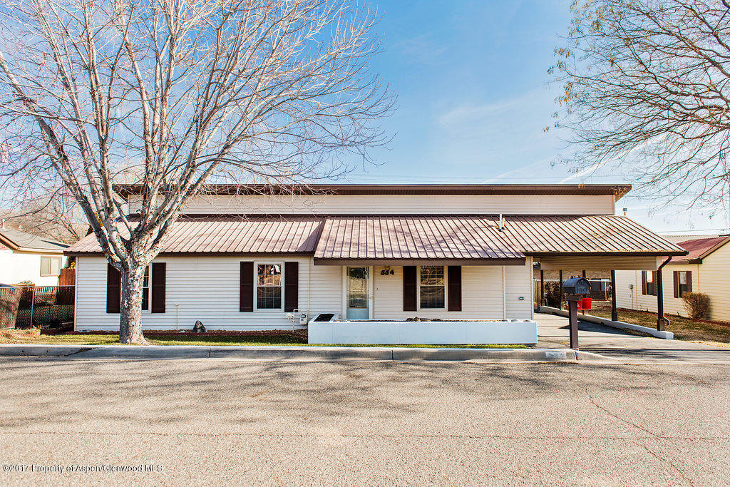 554 Jarrad Avenue Rifle, CO 81650 - Photo 2 of 21 a front view of a building with large trees