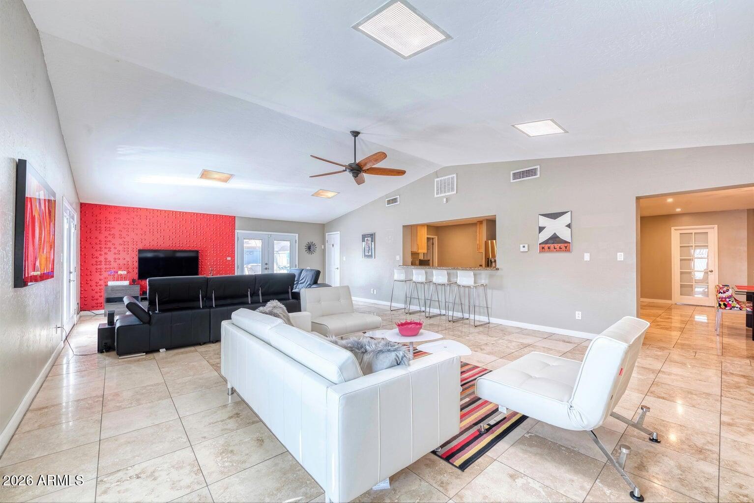 3415 East Camelback Road Phoenix, AZ 85018 - Photo 5 of 25 a living room with furniture and a flat screen tv