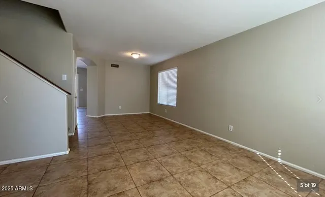 a view of an empty room and window