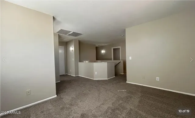 an empty room with a bathroom