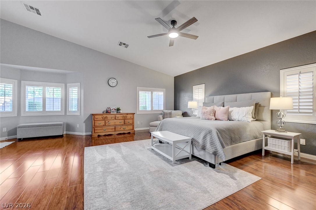 1604 Cattle Ranch Place Henderson, NV 89002 - Photo 31 of 99 Hardwood floors and a tray ceiling adorn this spacious sleeping sanctuary.