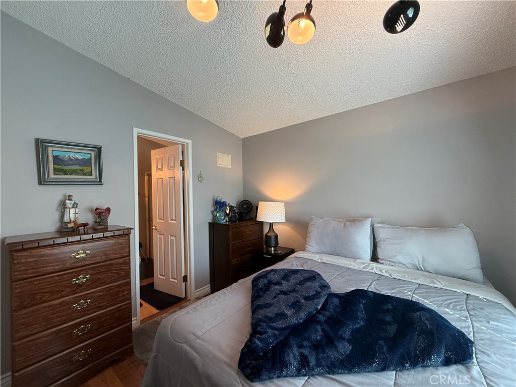 1550 Rory Lane Simi Valley, CA 93063 - Photo 11 of 26 a bedroom with a bed and cabinets