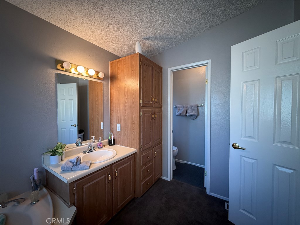 1550 Rory Lane Simi Valley, CA 93063 - Photo 13 of 26 a bathroom with a sink and a mirror
