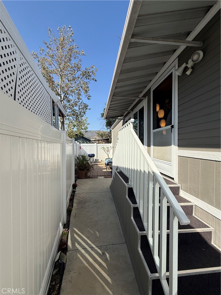 1550 Rory Lane Simi Valley, CA 93063 - Photo 24 of 26 a view of a hallway with wooden floor and staircase