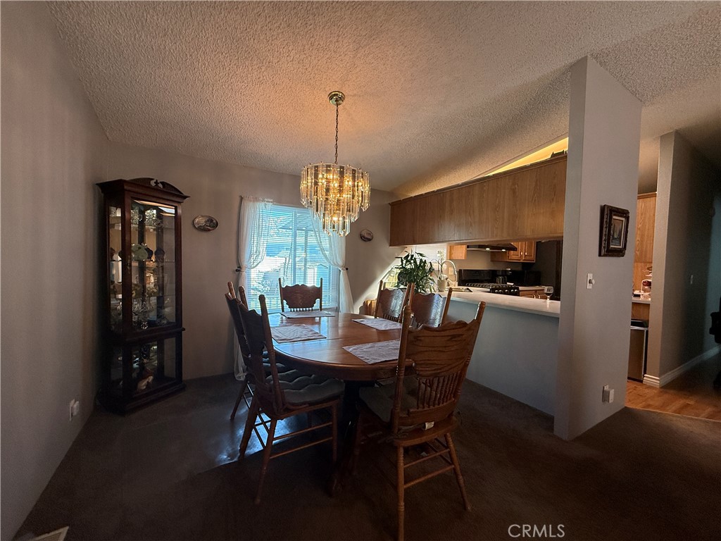 1550 Rory Lane Simi Valley, CA 93063 - Photo 6 of 26 a view of a dining room with furniture window and wooden floor