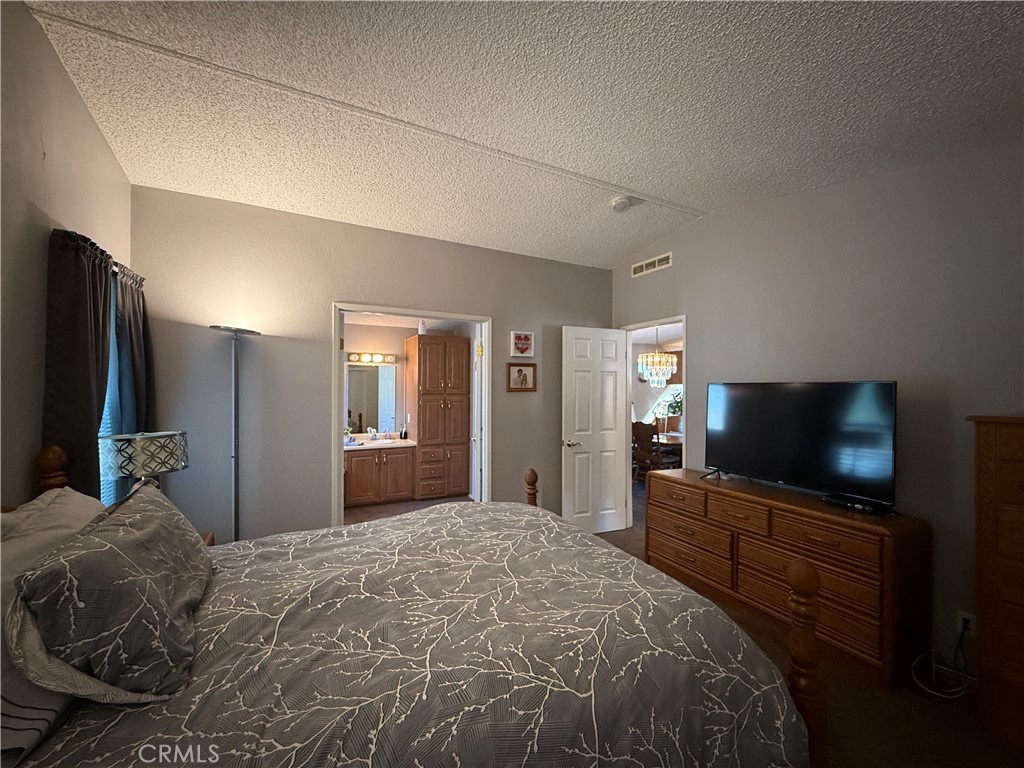 1550 Rory Lane Simi Valley, CA 93063 - Photo 7 of 26 a bedroom with a bed and a flat screen tv