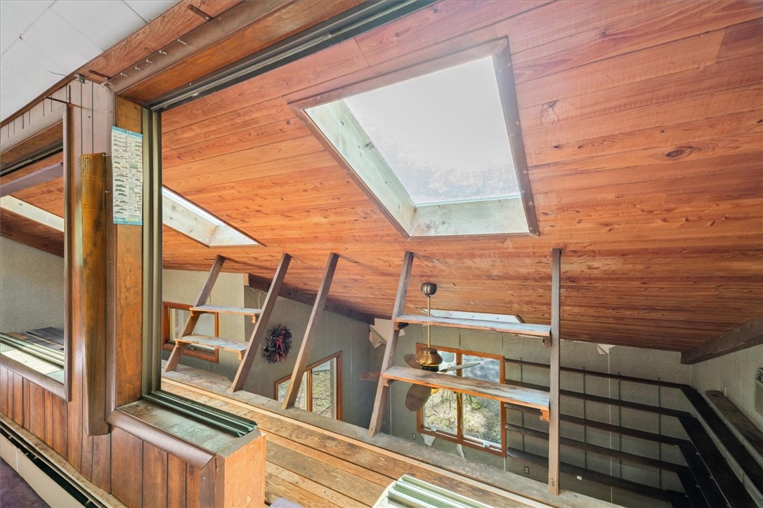 10 Midway Street Scituate, RI 02857 - Photo 14 of 35 3rd Floor loft space looking out to family room below, can easily be closed off for privacy.