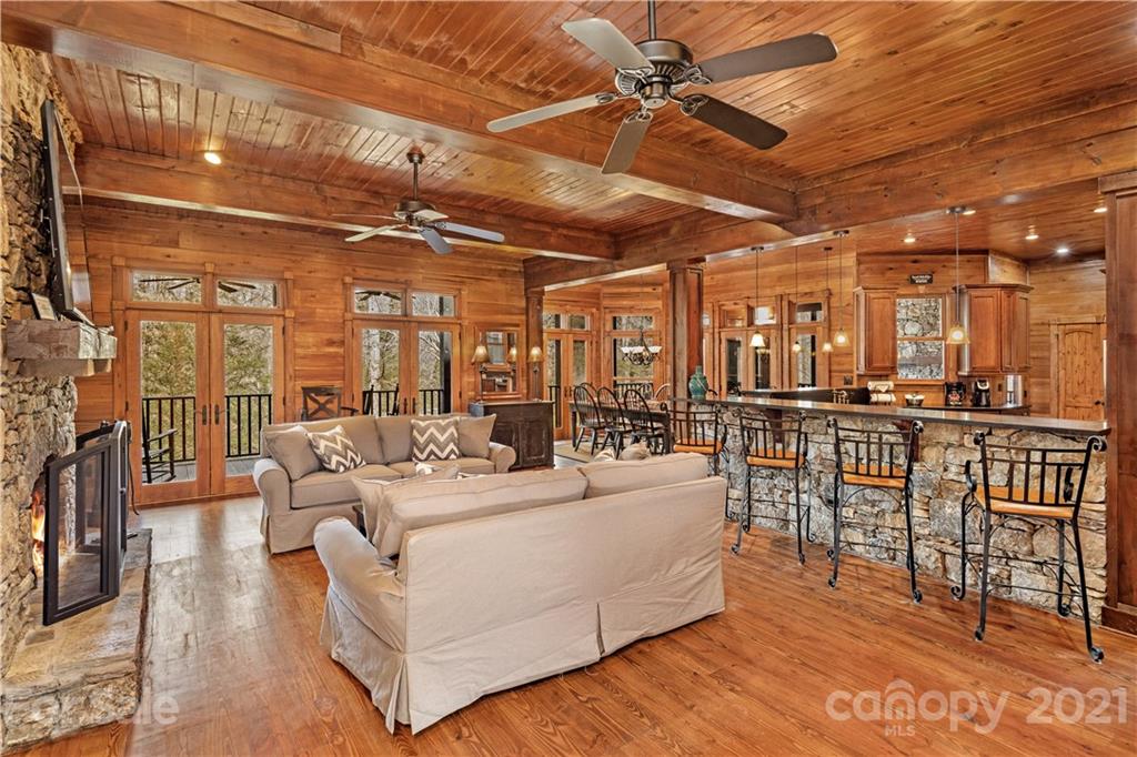 471 Chestnut Hill Loop Road Gerton, NC 28735 - Photo 11 of 45 a living room with furniture a ceiling fan and a rug
