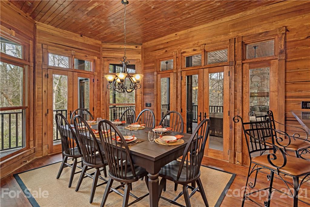471 Chestnut Hill Loop Road Gerton, NC 28735 - Photo 13 of 45 a view of an outside dining space with furniture