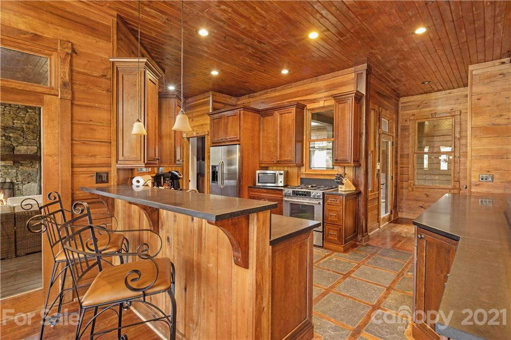 471 Chestnut Hill Loop Road Gerton, NC 28735 - Photo 14 of 45 a very nice looking dining room with chairs