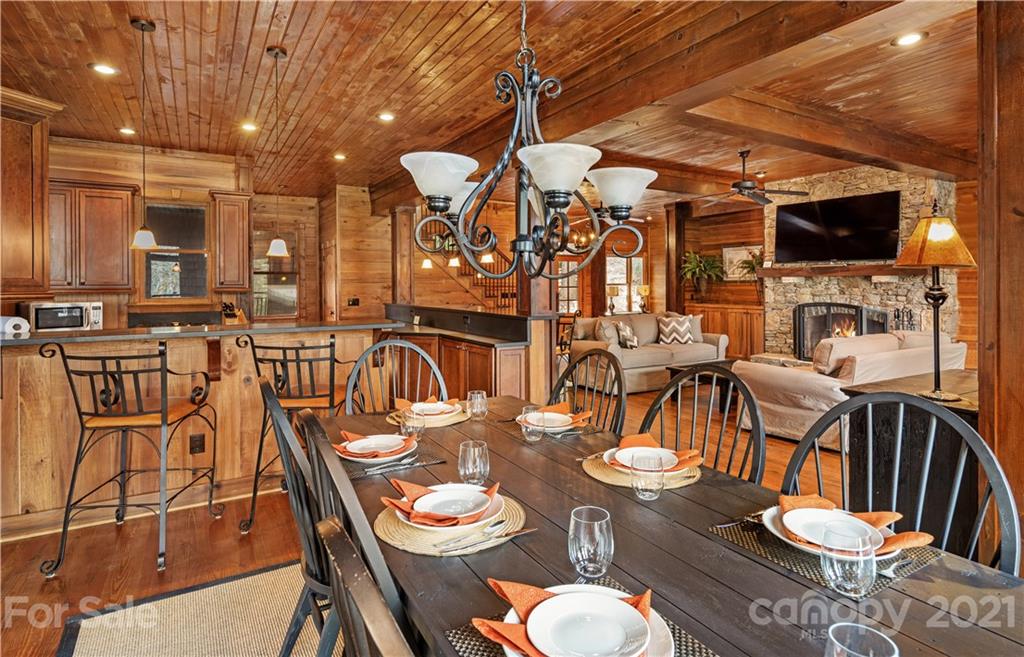 471 Chestnut Hill Loop Road Gerton, NC 28735 - Photo 19 of 45 a dining room with furniture and wooden floor