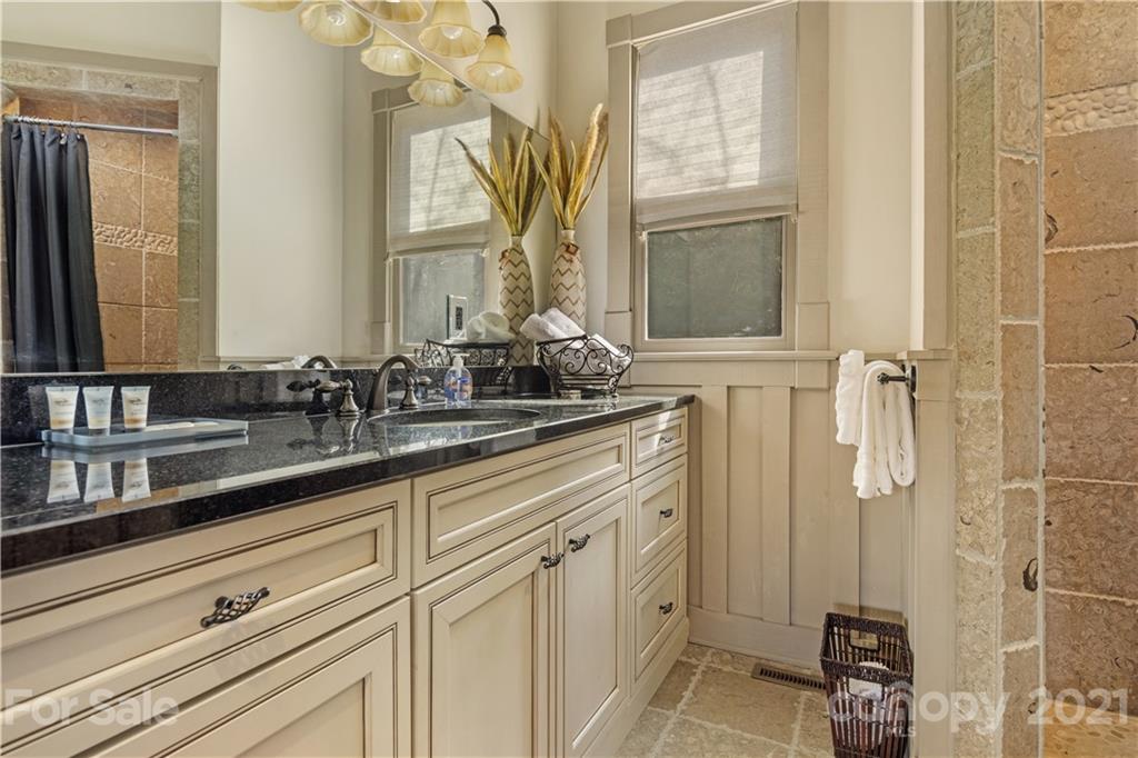 471 Chestnut Hill Loop Road Gerton, NC 28735 - Photo 22 of 45 a bathroom with a sink and a mirror