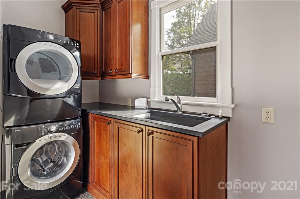 471 Chestnut Hill Loop Road Gerton, NC 28735 - Photo 23 of 45 a utility room with sink dryer and washer