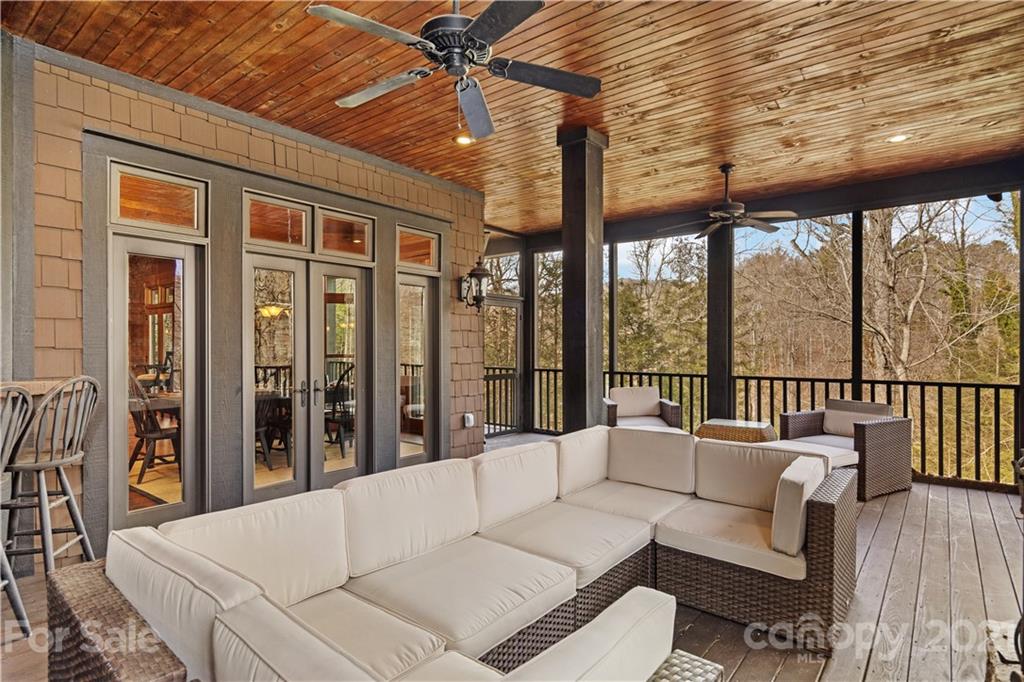 471 Chestnut Hill Loop Road Gerton, NC 28735 - Photo 25 of 45 a balcony with furniture and wooden floor