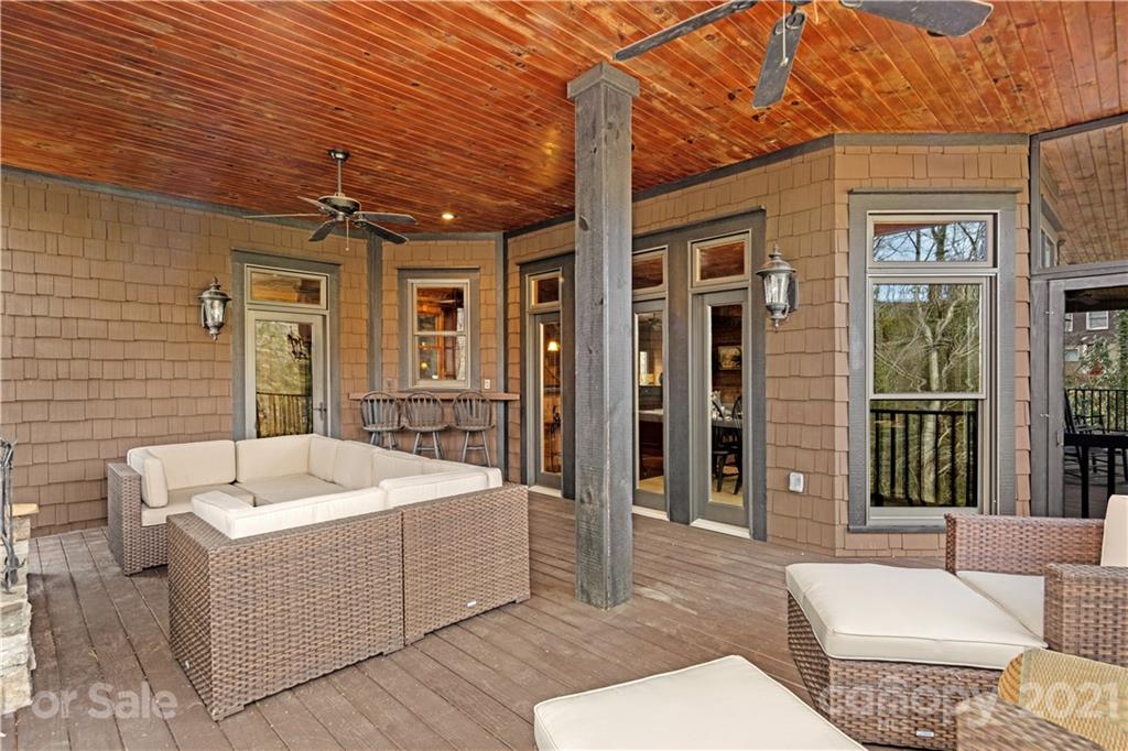 471 Chestnut Hill Loop Road Gerton, NC 28735 - Photo 27 of 45 a view of a patio with couches table and chairs