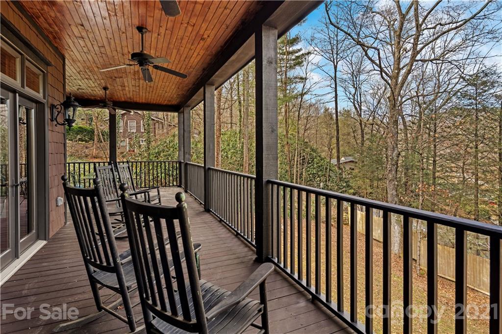 471 Chestnut Hill Loop Road Gerton, NC 28735 - Photo 29 of 45 a view of a balcony with furniture and wooden floor
