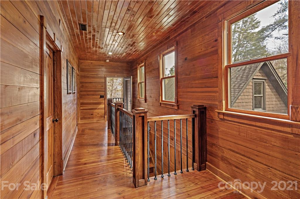 471 Chestnut Hill Loop Road Gerton, NC 28735 - Photo 30 of 45 a view of a house with stairs and wooden floor