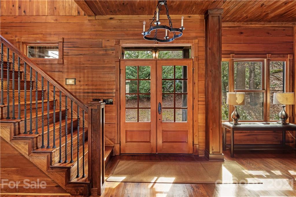 471 Chestnut Hill Loop Road Gerton, NC 28735 - Photo 4 of 45 a view of a balcony with door and wooden floor