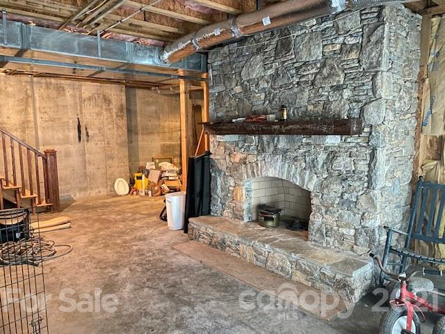 471 Chestnut Hill Loop Road Gerton, NC 28735 - Photo 43 of 45 a view of an empty room with a fireplace and a window